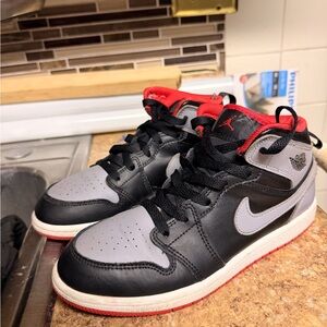 Black and Gray Sneakers with Red Accents